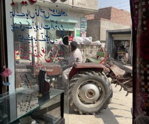 Tractor_crossing_as_seen_from_Faisal's_shop